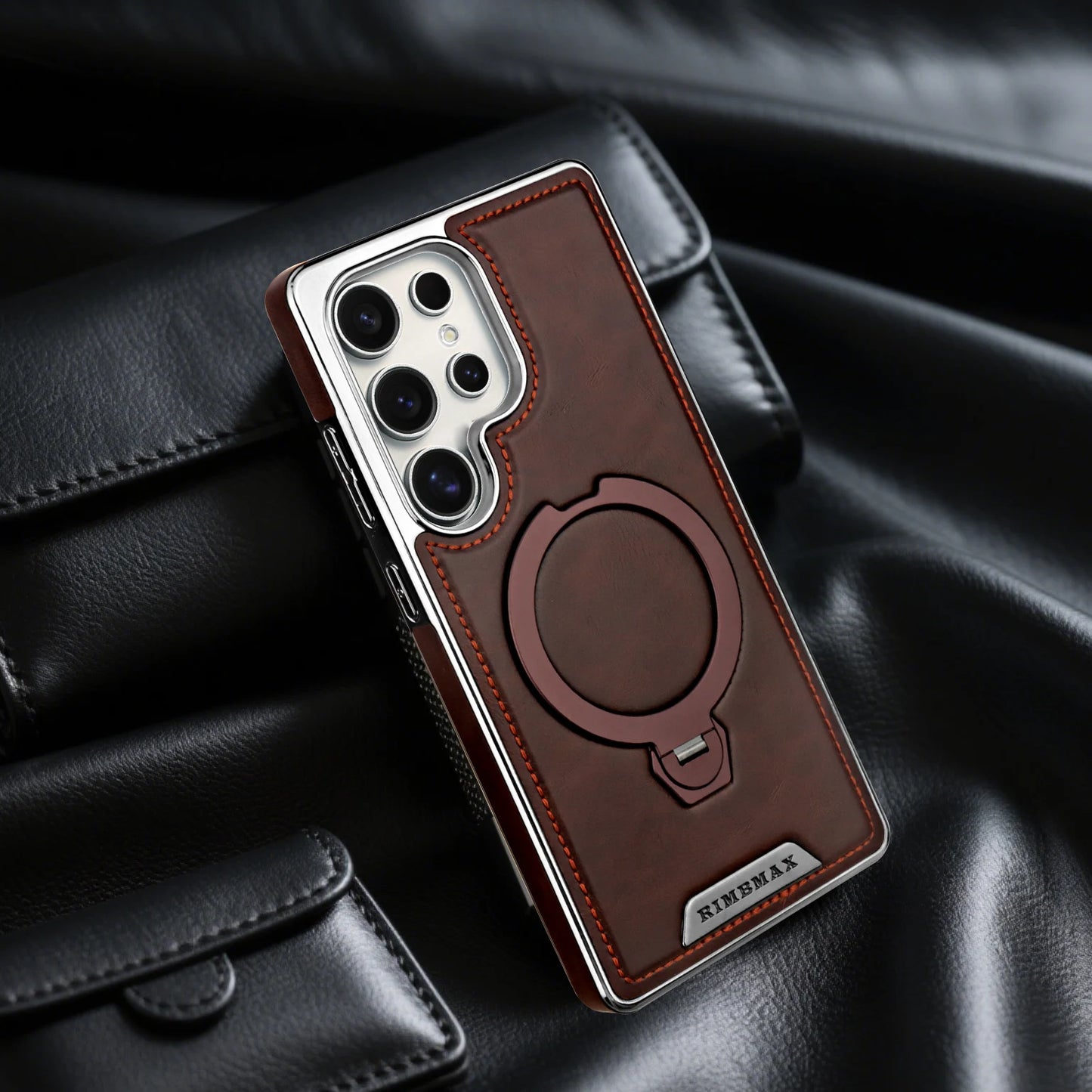 Brown leather phone case with magnetic ring stand on a black surface - Skycover